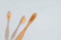 toothbrush.Teeth cleaning.Toothbrush in hand in bathroom. toothbrush from a transparent glass cup on the sink in a