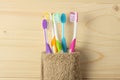 Toothbrush tooth-brush with bath towel on wooden table. top view with copy space Royalty Free Stock Photo