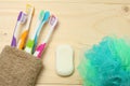 Toothbrush tooth-brush with bath towel on wooden table. top view with copy space Royalty Free Stock Photo