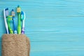 Toothbrush tooth-brush with bath towel on wooden table. top view with copy space Royalty Free Stock Photo