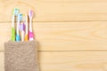 Toothbrush tooth-brush with bath towel on wooden table. top view with copy space Royalty Free Stock Photo