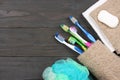 Toothbrush tooth-brush with bath towel on wooden table. top view with copy space Royalty Free Stock Photo
