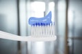 Toothbrush with toothpaste against blurred background, closeup Royalty Free Stock Photo