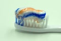 Toothbrush and toothpaste on blurred background . Royalty Free Stock Photo