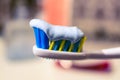 Toothbrush and toothpaste on blurred background Royalty Free Stock Photo