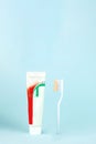 Toothbrush and toothpaste on blurred blue background. Oral Care Concept. Concept of oral hygiene in the family Royalty Free Stock Photo