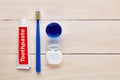 Toothbrush, toothpaste, dental floss and mouthwash on wooden table Royalty Free Stock Photo