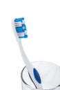 Toothbrush with toothpaste in glass cup Royalty Free Stock Photo