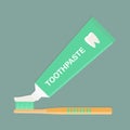 A toothbrush and toothpaste. Squeezing toothpaste on the brush.