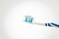 Toothbrush with toothpaste on a wigh background, close up Royalty Free Stock Photo