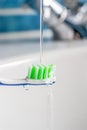 Toothbrush under running Water Royalty Free Stock Photo