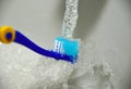 Toothbrush Under Tap Royalty Free Stock Photo