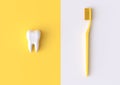 Toothbrush and white tooth on a yellow background Royalty Free Stock Photo