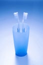 Toothbrushes in a cup. Conceptual image