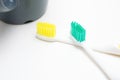 Toothbrushes and cup on white background Royalty Free Stock Photo
