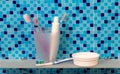 Toothbrushes and dentifrice on a shelf Royalty Free Stock Photo
