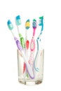 Toothbrushes in glass isolated on white background