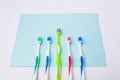 Toothbrushes on light blue background, close up different kinds of Toothbrushes, new not used, isolated for text insertion, one of Royalty Free Stock Photo