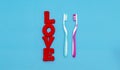 Toothbrushes in love on blue background.Love and Valentines day concept.Creative flat lay photo.Top view.Copy sace Royalty Free Stock Photo