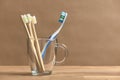 Toothbrushes, a plastic one and a set of three ecological made of bamboo