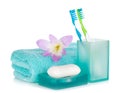 Toothbrushes, soap, towel and flower Royalty Free Stock Photo