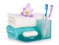 Toothbrushes, soap, two towels and flower Royalty Free Stock Photo