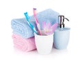 Toothbrushes, soap, two towels and flower Royalty Free Stock Photo