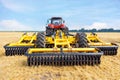 Toothed metal multi-row yellow harrow as a tractor hitch for agricultural processing of fields