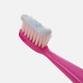 Toothpaste on pink toothbrush isolated on white background Royalty Free Stock Photo