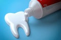 Toothpaste in the shape of tooth coming out from toothpaste tube. Brushing teeth dental concept