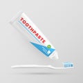 Toothpaste is squeezed out of tube onto toothbrush. Dental oral hygiene product packaging