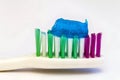 Toothpaste on a toothbrush close-up on a white light background Royalty Free Stock Photo