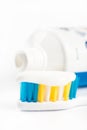 Toothpaste on toothbrush in closeup macro with toothpaste in the background Royalty Free Stock Photo