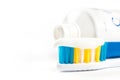 Toothpaste on toothbrush in closeup macro with toothpaste in the background Royalty Free Stock Photo