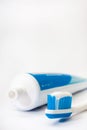 Toothpaste on a toothbrush with a tube Royalty Free Stock Photo