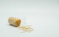 Toothpicks in a clear plastic bottle. And some fell on the floor,Toothpick slant Royalty Free Stock Photo