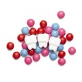 Tooths and sweet candy on a white background. Harmful sugary foods for teeth