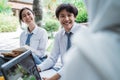 toothy smile of a boy and girl high school student chatting with friends while studying a group Royalty Free Stock Photo