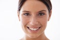 A toothy smile just for you. Closeup portrait of a beautiful young woman isolated on white. Royalty Free Stock Photo