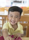 Toothy smiling face happiness emotion of asian children sitting Royalty Free Stock Photo