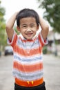 Toothy smiling face happiness emotion of asian children standing outdoor Royalty Free Stock Photo