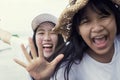 Toothy smiling face of two asian teenager happiness emotion Royalty Free Stock Photo