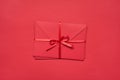 Top above flatlay close up view photo of pile stack of envelopes tied with silky ribbon isolated vivid color red background