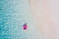 Top above high angle aerial drone view of her she attractive girl rich chic lady floating on rubber ring in clean clear Royalty Free Stock Photo