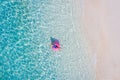 Top above high angle aerial drone view of her she attractive girl rich chic lady floating on rubber ring in clean clear Royalty Free Stock Photo