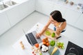 Top above high angle photo of positive cheerful housewife want prepare feast supper use her laptop search veggie organic Royalty Free Stock Photo