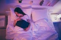 Top above high angle view of nice attractive peaceful dreamy girl lying in bed covered by soft blanket fallen asleep Royalty Free Stock Photo