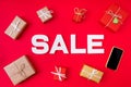 Top above high angle view photo of new year sales and discount with wrapped gifts and telephone offered isolated vivid Royalty Free Stock Photo