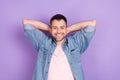 Top above high angle view photo of young man happy positive smile hands behind head rest relax isolated over violet Royalty Free Stock Photo