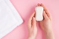 Top above overhead close up pov first person view photo of female hands holding soap isolated on pastel pink background with a Royalty Free Stock Photo